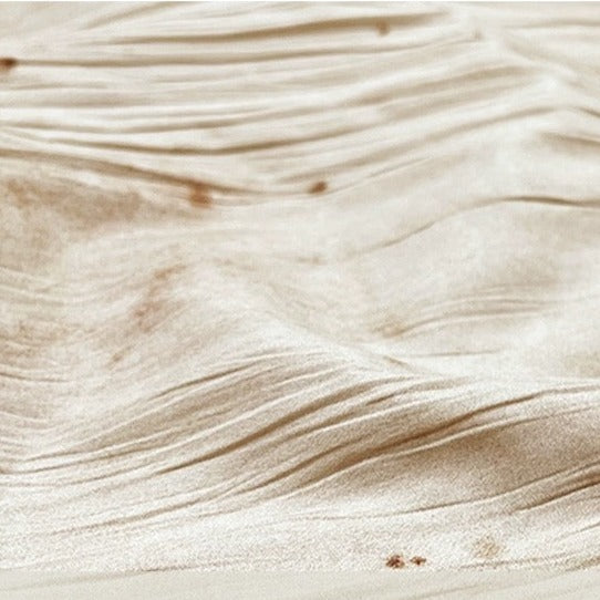 Details of fabric for apricot-colored classical ballet trousers.